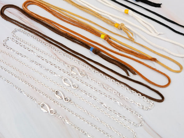 collection of all kinds of goros chains and leather cords