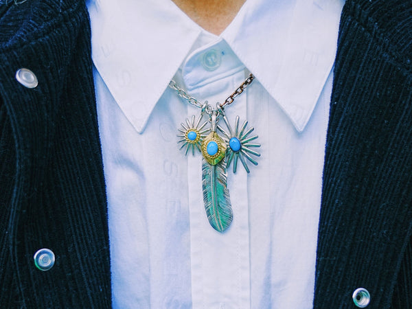 goros setup with sea urchin with gold rope turquoise and sea urchin with turquoise pendant and silver top gold rope turquoise feather